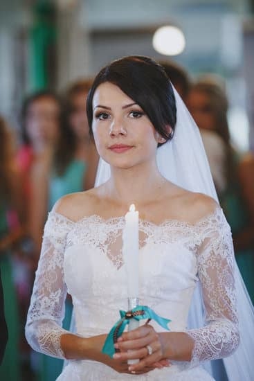 Woman in elegant red dress at romantic winter wedding