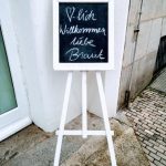 How Big a Wedding Cake for 100 Guests Large tiered wedding cake serving 100 guests beautifully decorated with floral accents and elegant details